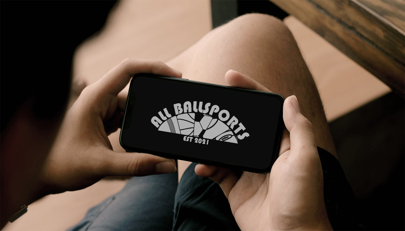 All Ballsports website on smartphone screen for online ordering of Cooper Cricket