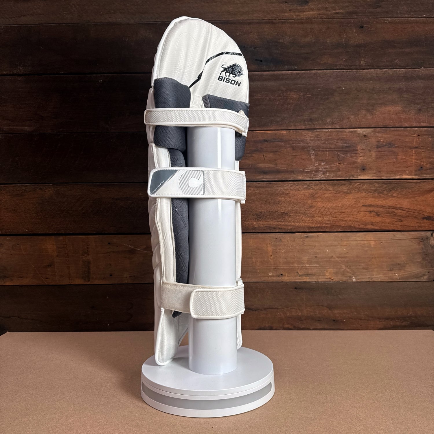 Bison Cricket Pads 2024-25 for youth, showcasing premium foam protection and a snug fit on display.