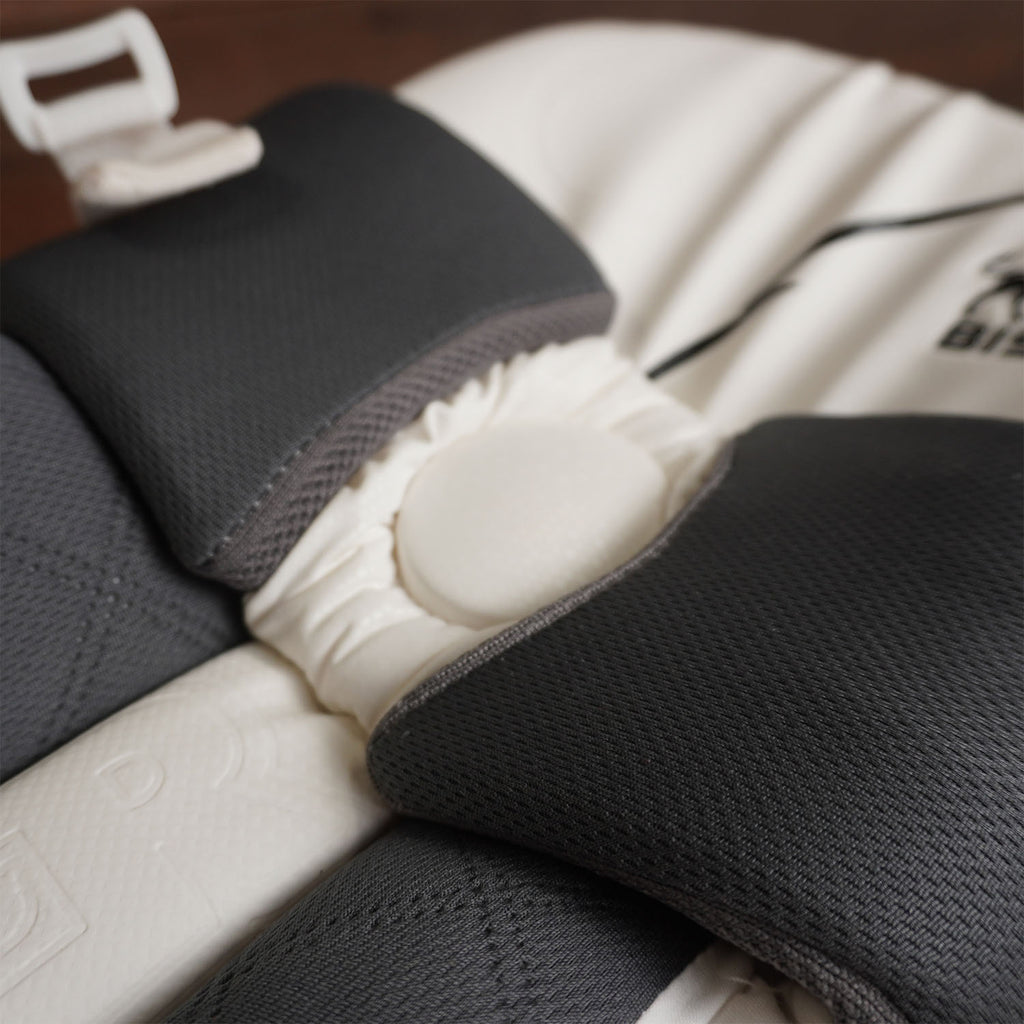Close-up of Bison Cricket Pads showcasing premium foam and snug fit for youth players, designed for protection and comfort.