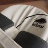 Close-up of Bison Cricket Pads showcasing premium foam and logo, designed for youth cricket protection and performance.