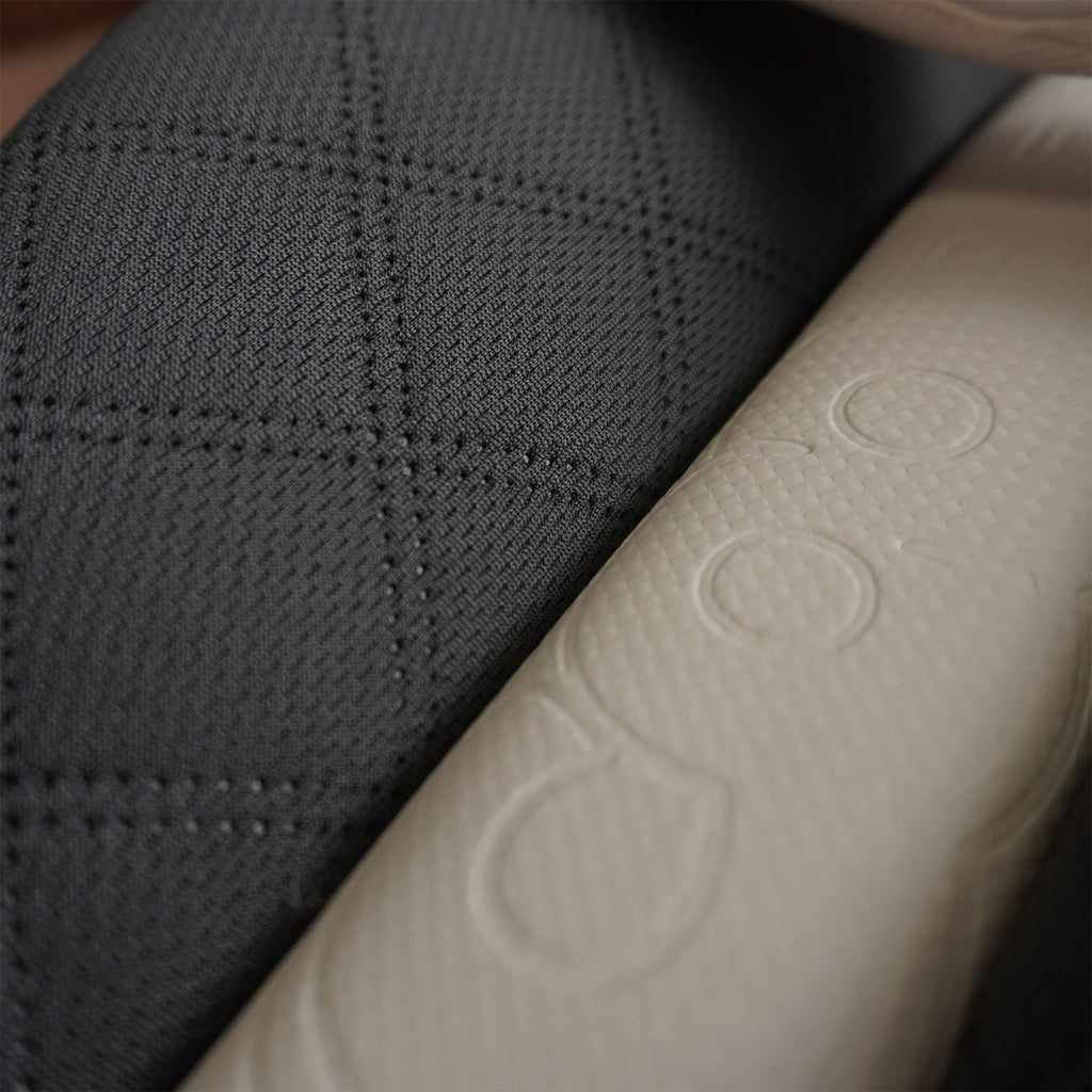 Close-up of Bison cricket pads showcasing premium foam texture and modern design for youth protection.
