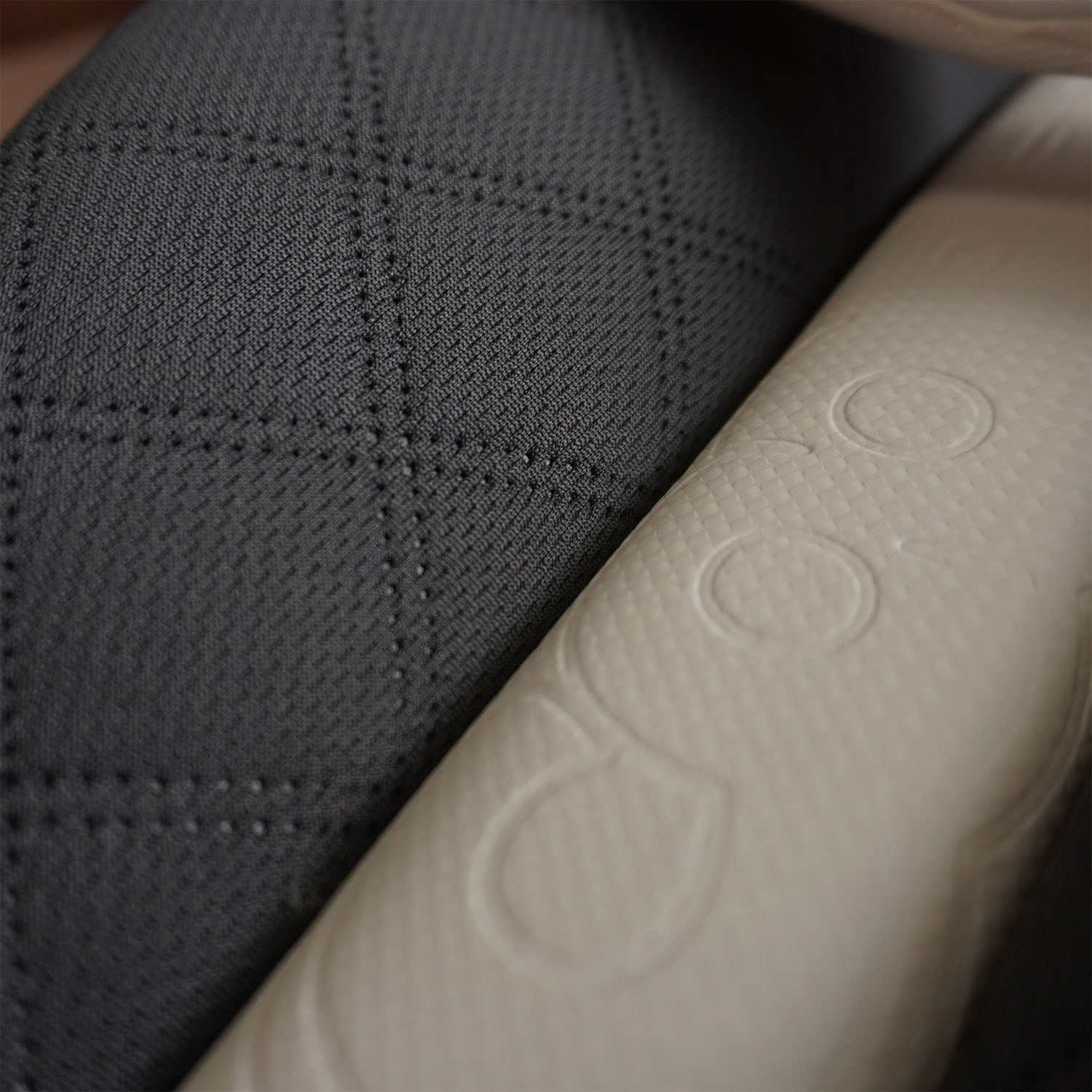Close-up of Bison cricket pads showcasing premium foam texture and modern design for youth protection.