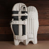 Bison Cricket Pads 2024-25 in white with adjustable straps, offering premium protection for youth players.