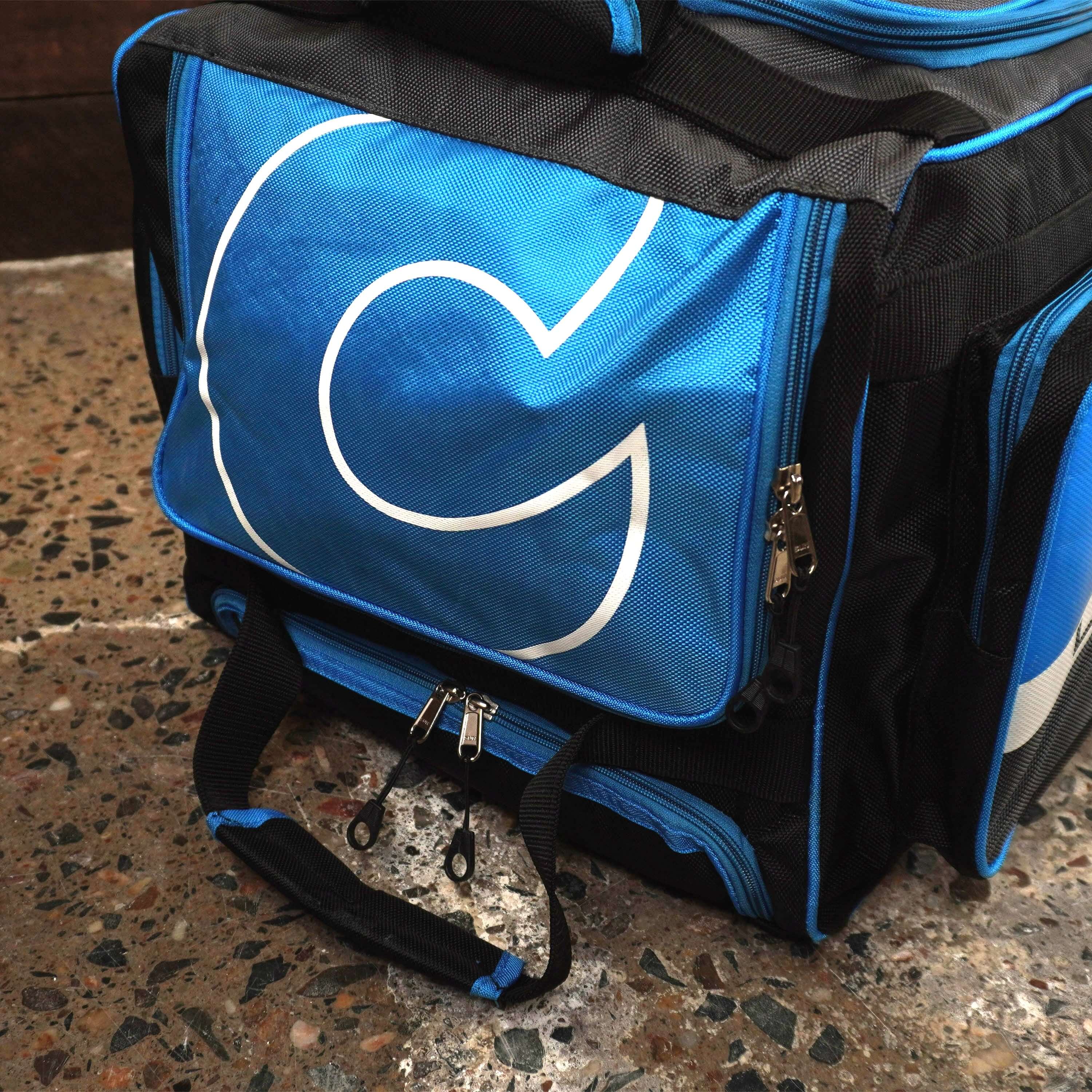 Blue LK7 cricket bag with multiple compartments for organized storage, featuring sturdy zippers and a stylish design.