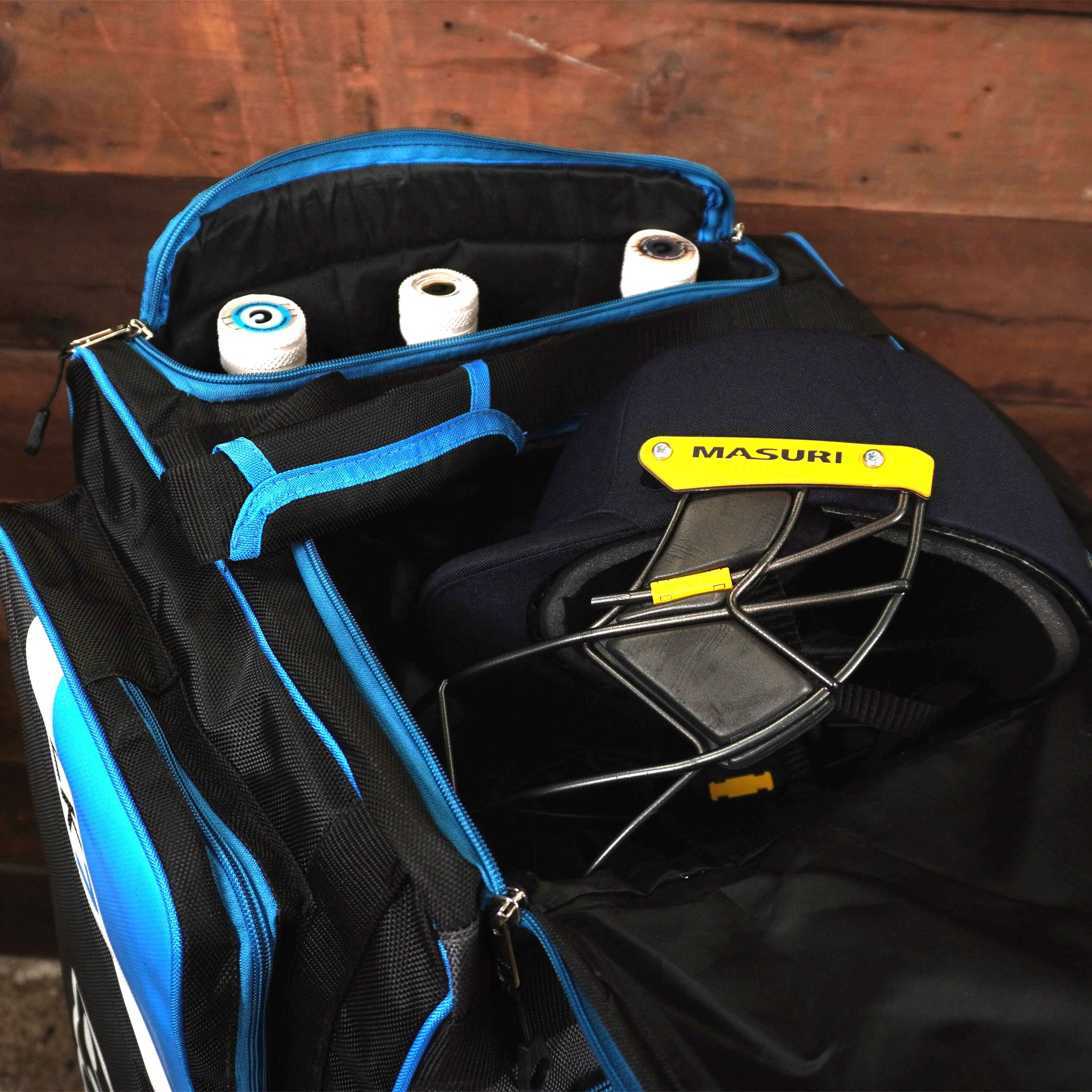Cricket bag with helmet and accessories inside compartments, ideal for organizing equipment.