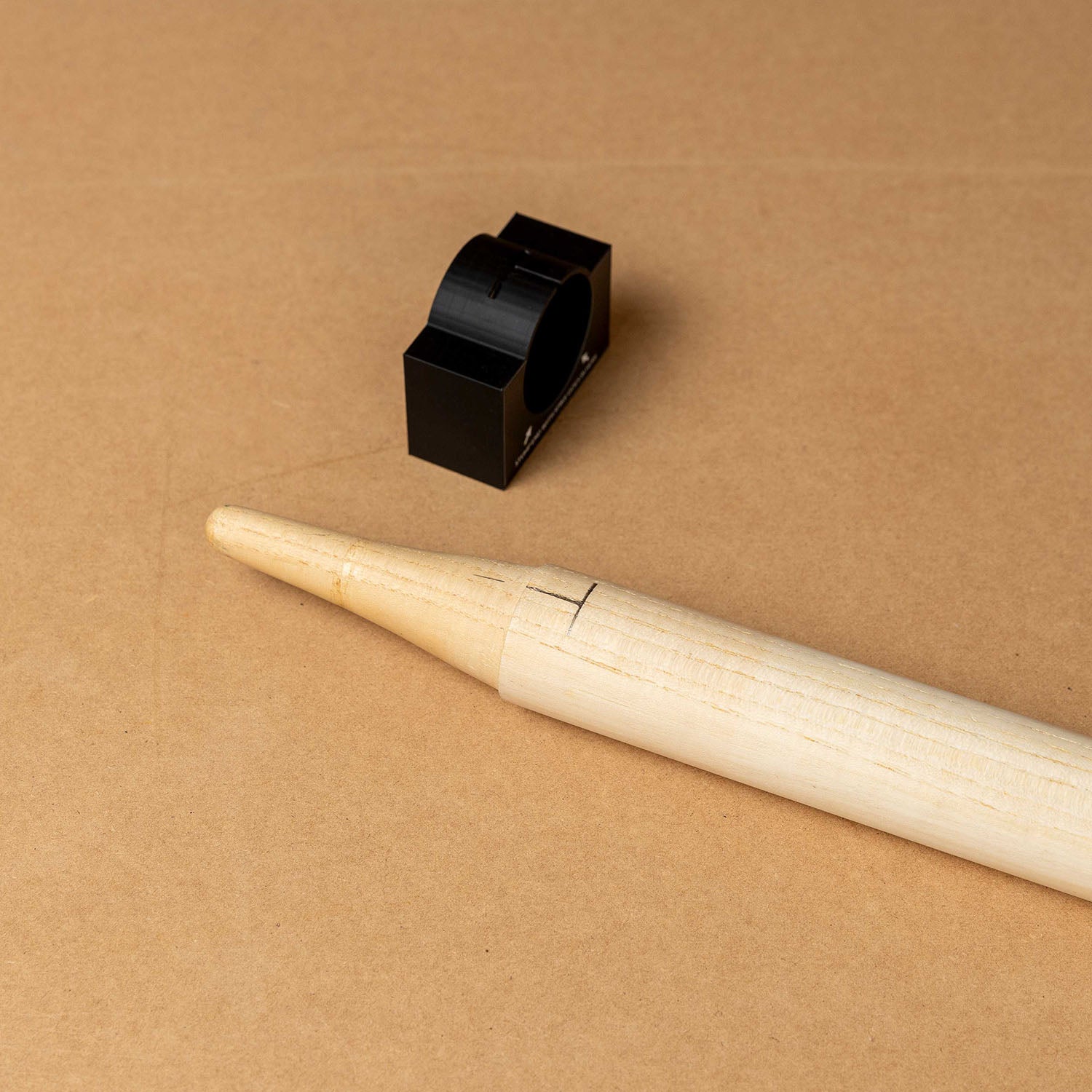 Cricket stump marker tool for precise sticker alignment on a wooden stump, ideal for custom stump wrap applications.