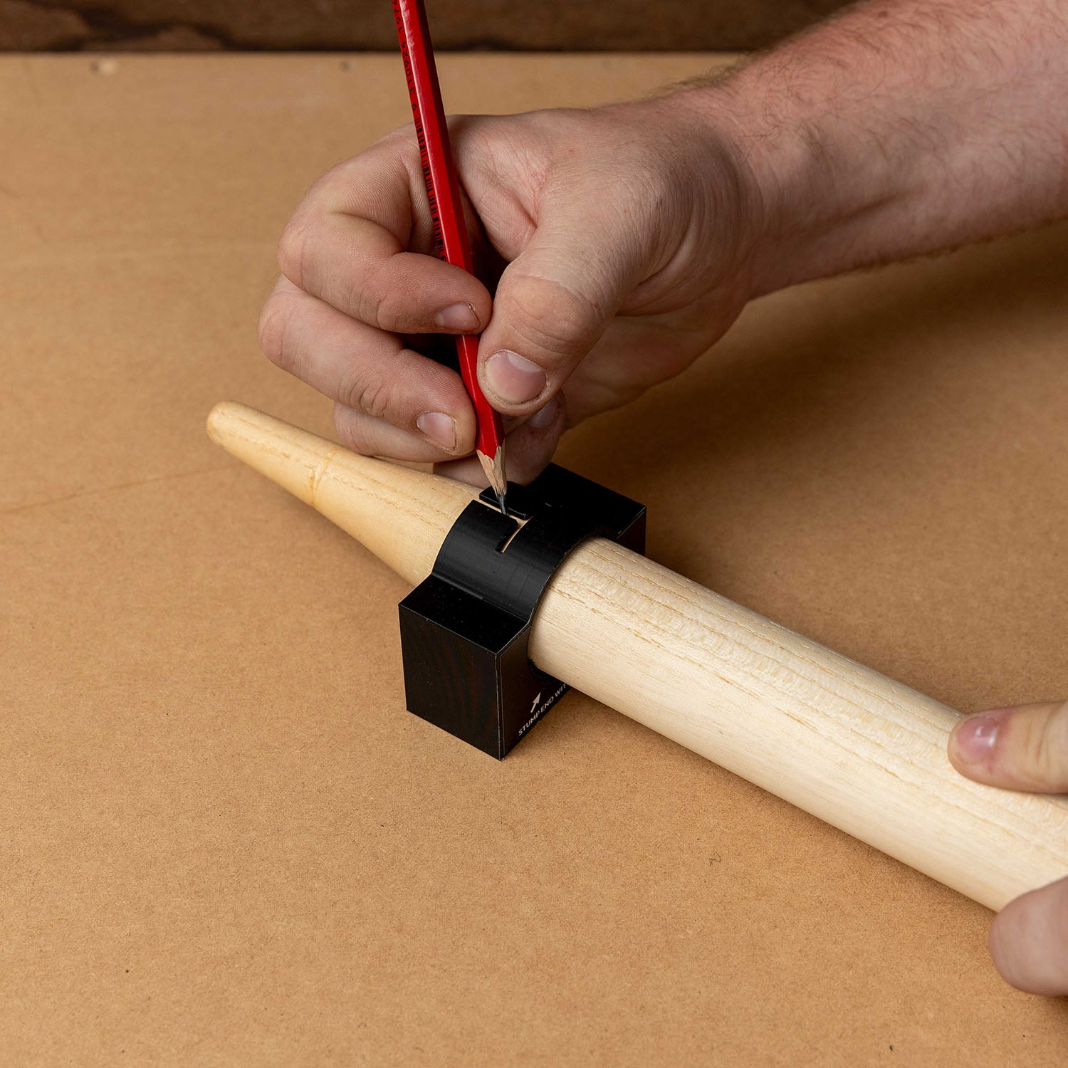 Cricket Stump Marker tool aligning custom wrap stickers on a wooden stump for precise application.