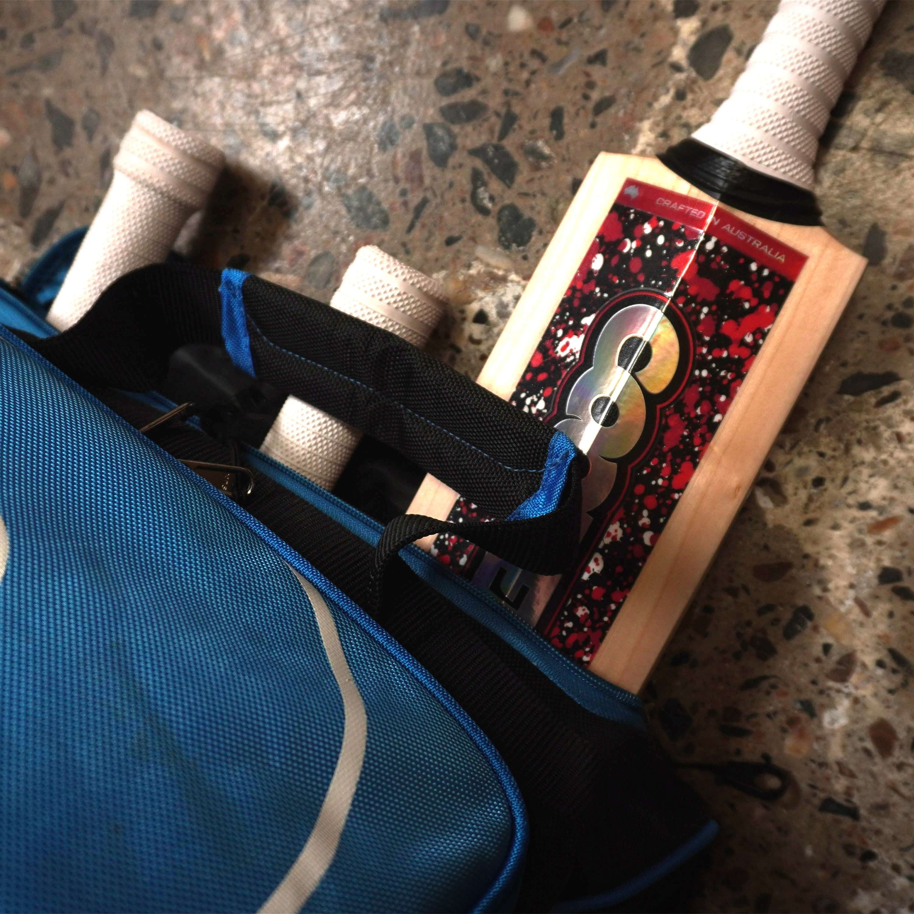LK9 cricket bag with bats, designed for serious cricketers, featuring large storage and compartments for essential gear.