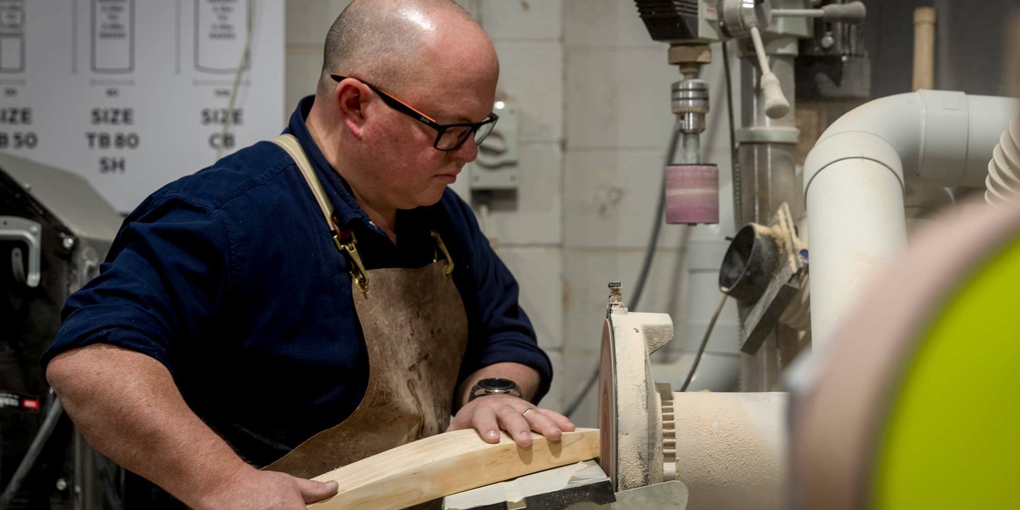 Rod Grey from Cooper Cricket sanding the toe of a cricket bat