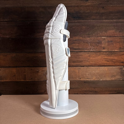 Bison cricket pads 2024-25 youth model displayed on a stand, featuring premium foam and sleek design for protection and comfort.