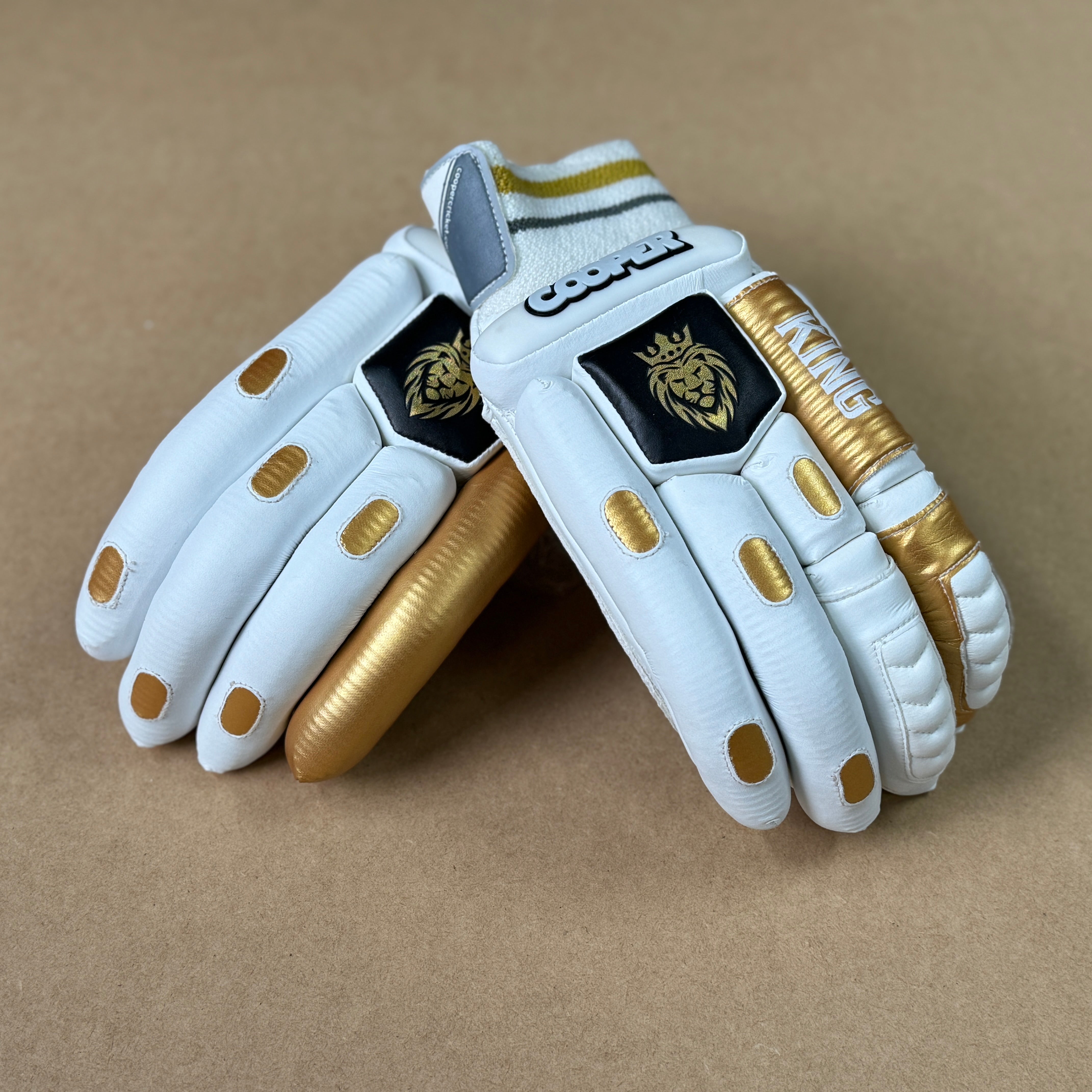 KING Gloves 2024/25 with premium calf leather, 3D styling, and AIRTEC gussets for ventilation laid on a brown background.