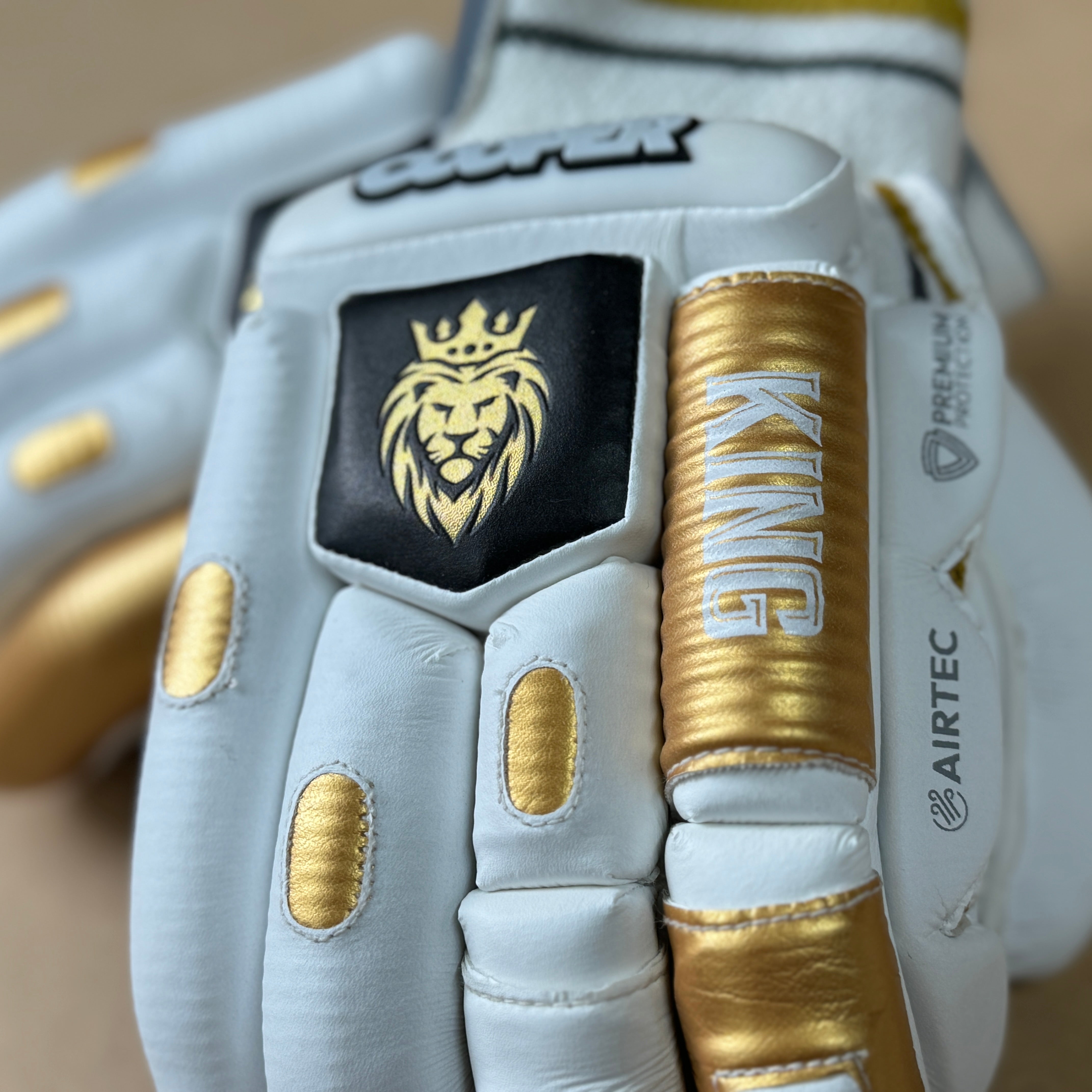 KING Gloves 2024/25 with gold and black 3D styling, featuring premium calf leather and AIRTEC gussets for ventilation and comfort.