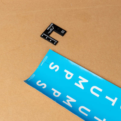 Cricket stump marker tool with blue custom sticker for perfect alignment on stumps.