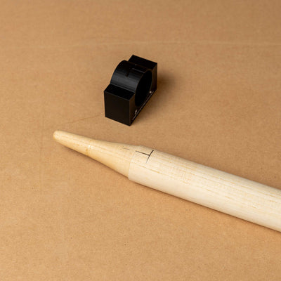 Cricket stump marker tool for precise sticker alignment on a wooden stump, ideal for custom stump wrap applications.