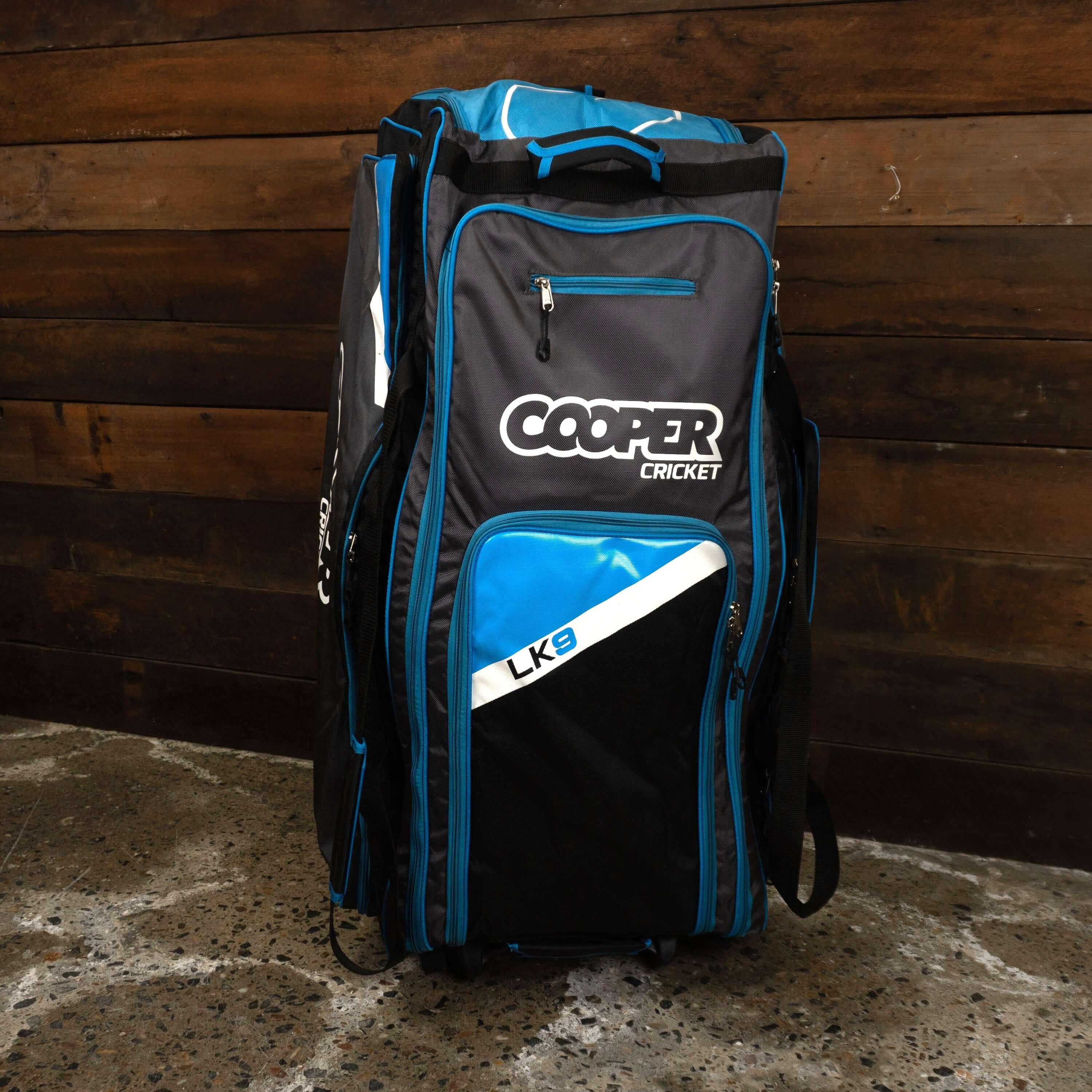 Large LK9 cricket bag with multiple compartments, designed for serious cricketers, featuring space for gear and up to 3 bats.