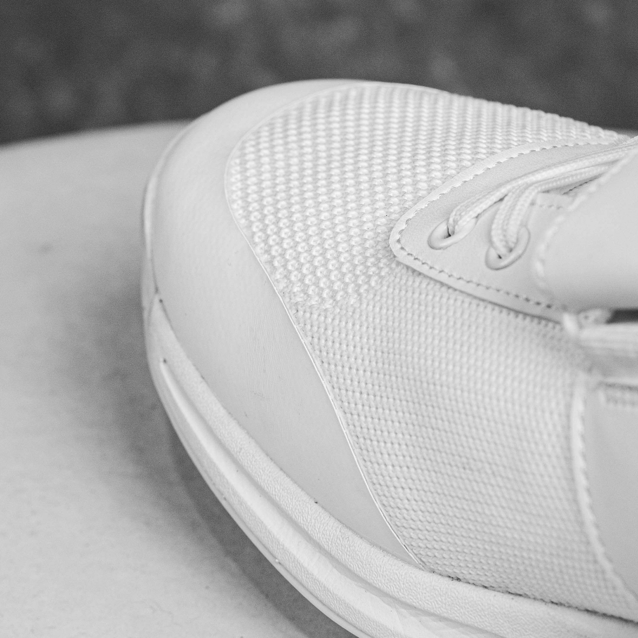 Close-up of the Idoneus ID1 Cricket Shoe showcasing durable design and quality stitching with focus on the upper fabric and laces.