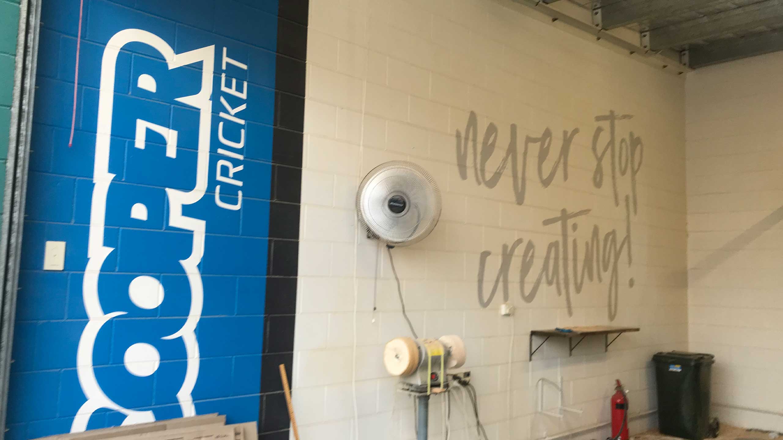 Cooper Cricket workshop wall: never stop creating