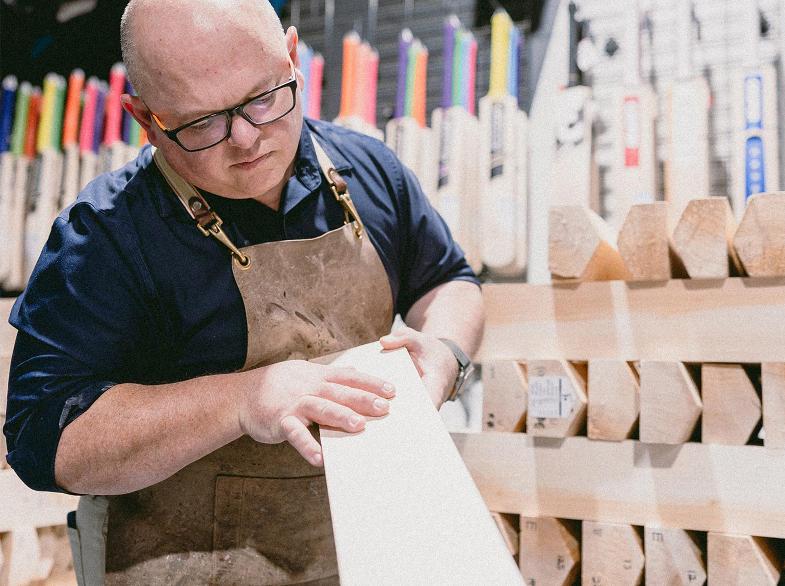 Rod Grey checking a willow blade in the Cooper Cricket workshop