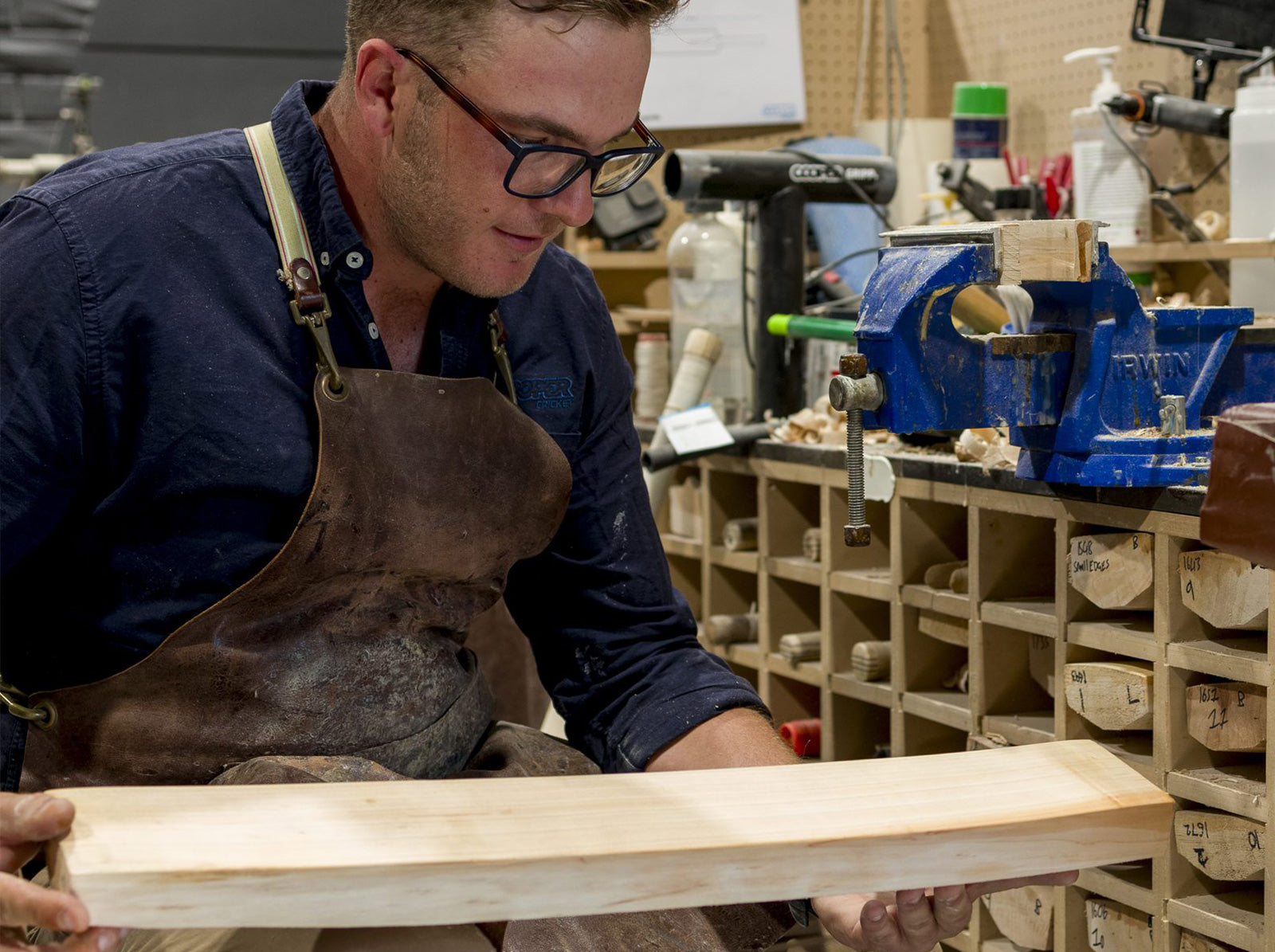 Checking the curve of a shaped cricket bat blade in the Cooper Cricket workshop